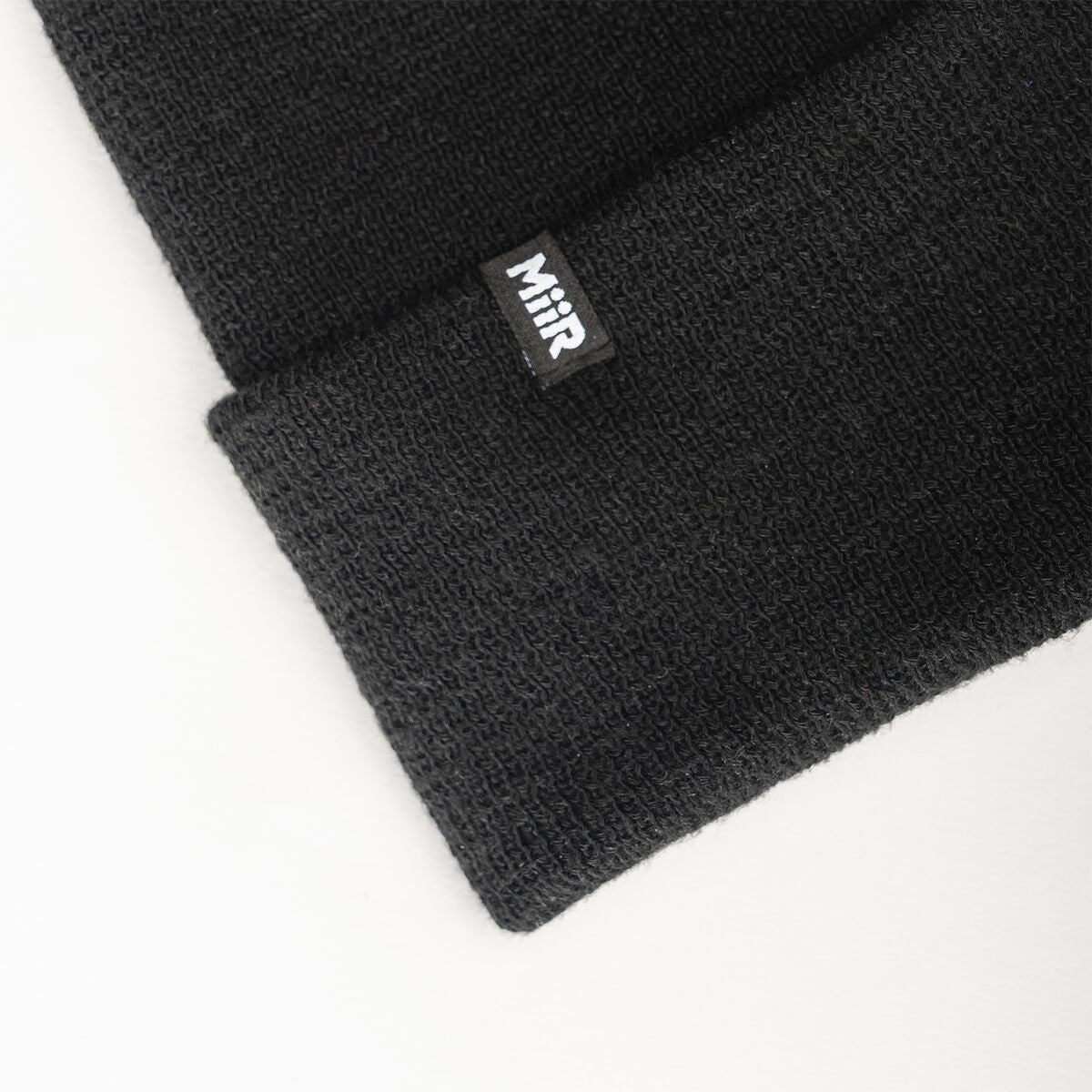 recycled-poly-fine-knit-beanie-h3 WebPDP-RecycledPolyFineKnitBeanie_Studio_TagDetail_Black__BNE005002OS.jpg