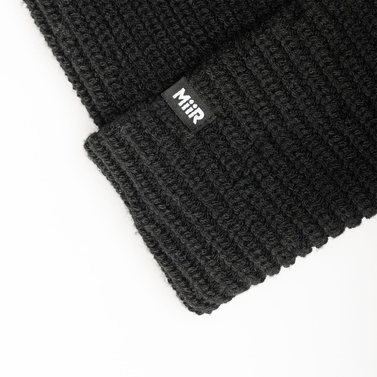 recycled-poly-rib-beanie-t5 WebPDP-RecycledPolyRibBeanie_Studio_TagDetail_Black__BNE002002OS.jpg